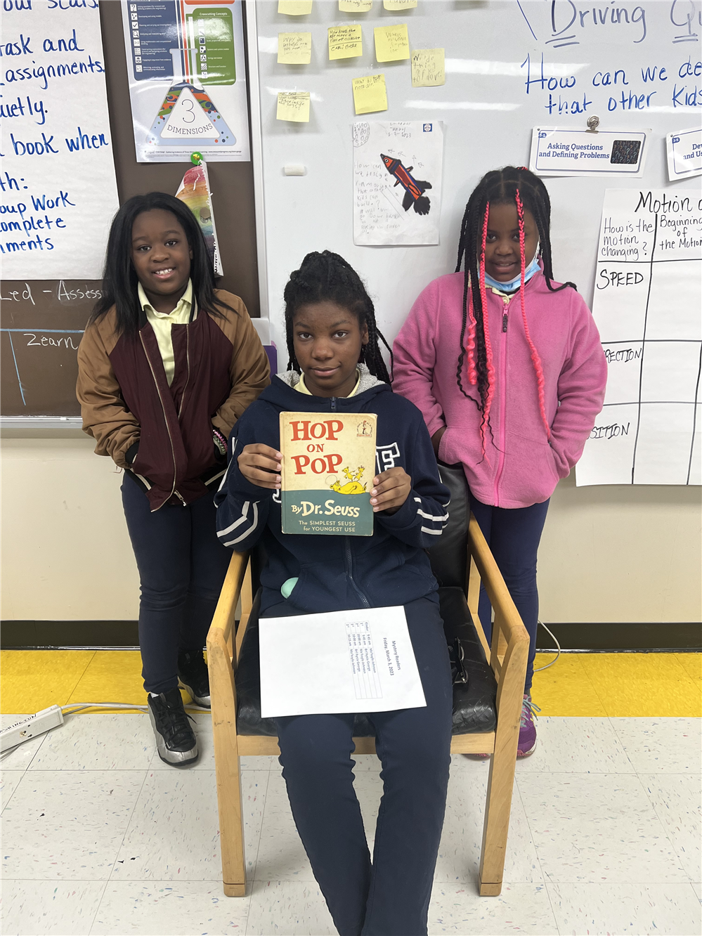  5th graders reading to students for reading month